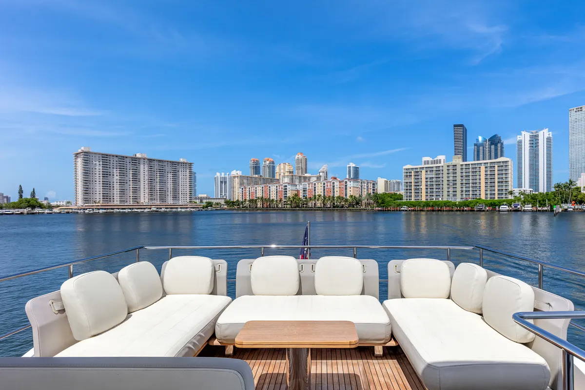 Guests on the foredeck of a MARE yacht during a Biscayne Bay charter